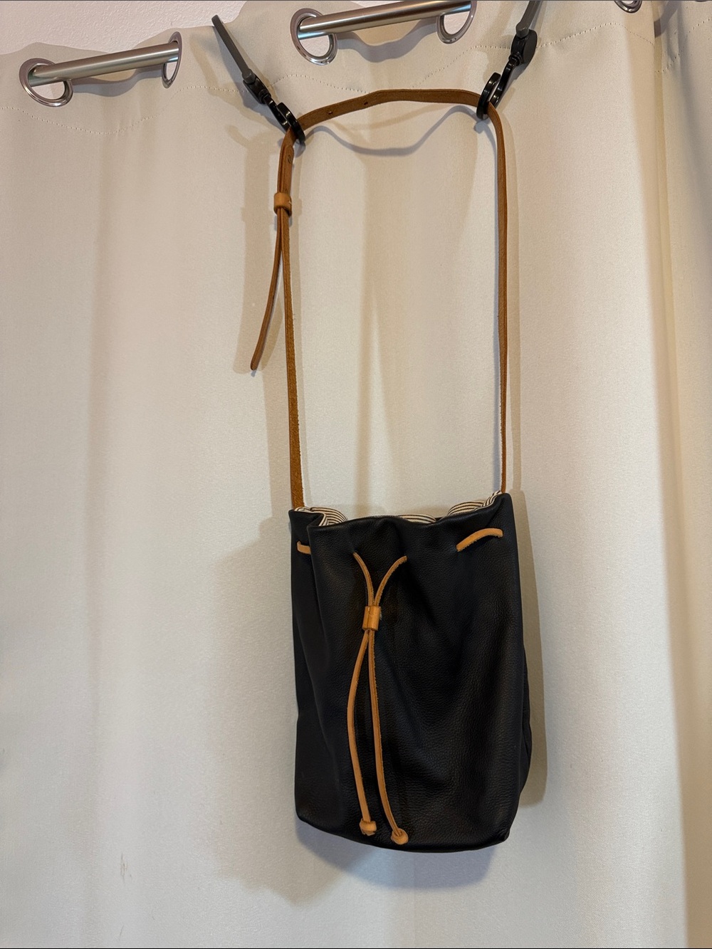 Umbrella Collective Black Leather Drawstring Crossbody Bag with Tan Strap